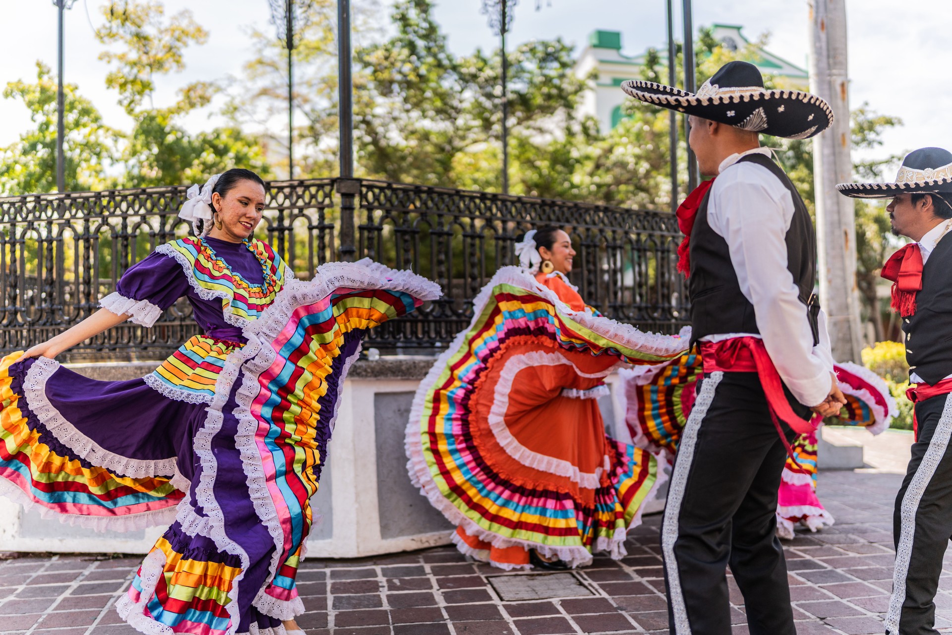 Dancers dancing in traditional festival outdoors